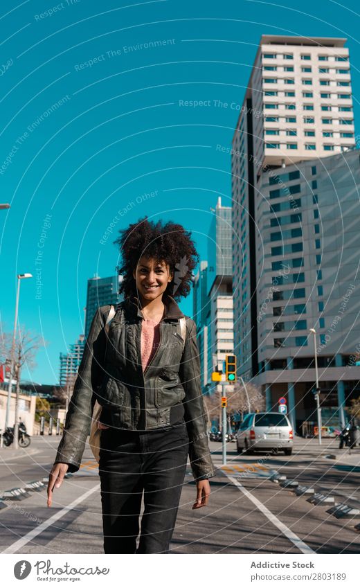 Woman with afro hair walking through the streets African American Bag Beautiful Black Business Easygoing City Curly Fashion Girl Hair Happy Lifestyle