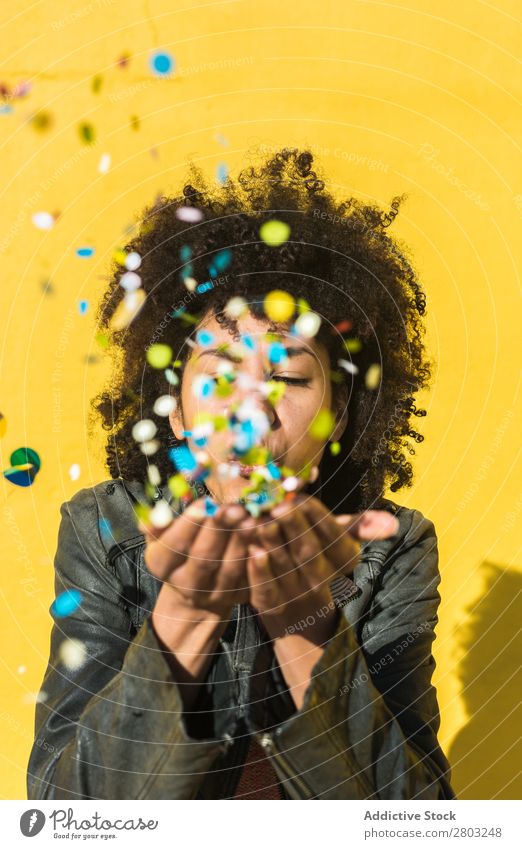 Black woman with afro hair celebrating with confetti. African Afro Background picture Beautiful Beauty Photography Birthday Blue Guest Feasts & Celebrations