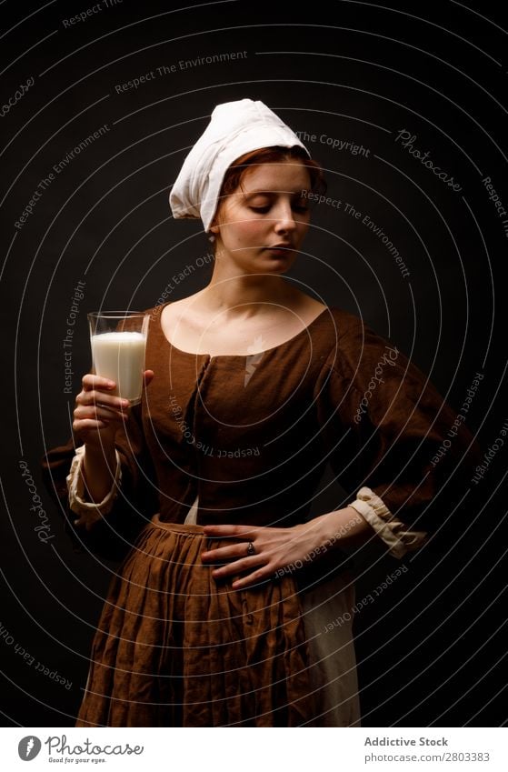 Medieval maid with glass of milk medieval Red-haired Milk Glass Woman Closed eyes Clothing historical Dress Costume maiden Car Hood Renaissance Vintage Retro