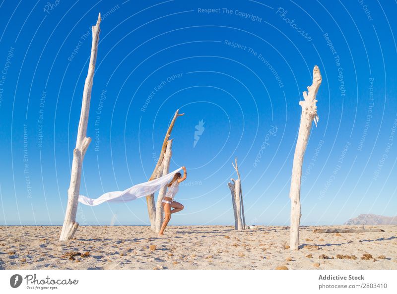 Woman jumping with pareo on beach Beach Rest Jump Summer Vacation & Travel Youth (Young adults) Relaxation Lifestyle Ocean Beautiful Trunk Blue sky