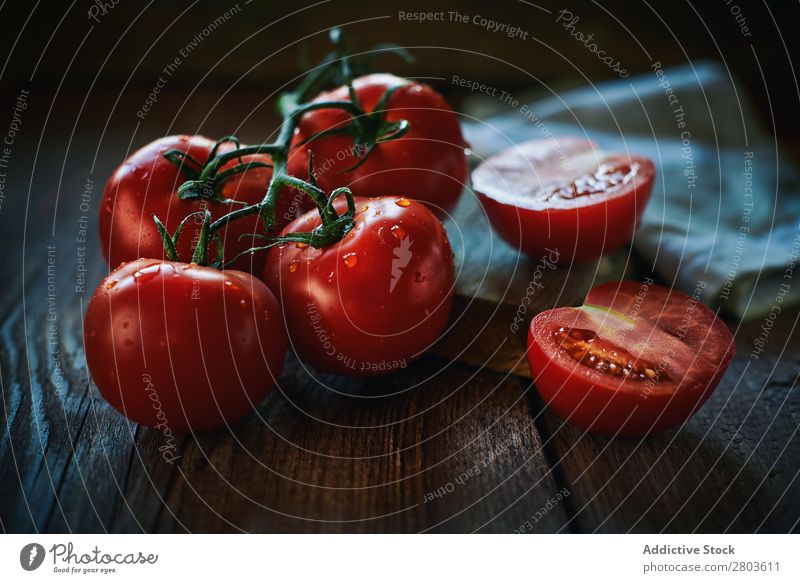 Fresh tomatoes on wooden table Tomato Table Wet Napkin bunch Healthy Red Food Vegetable Organic Mature Ingredients Vegan diet Half Cut whole Diet Raw Kitchen