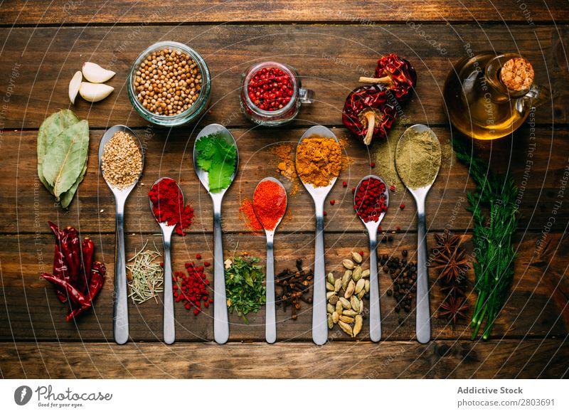 Set of various spices on table Herbs and spices Table assortment Oil Cooking Ingredients Fresh Dill Parsley Garlic anise turmeric Cardamom Coriander Chili