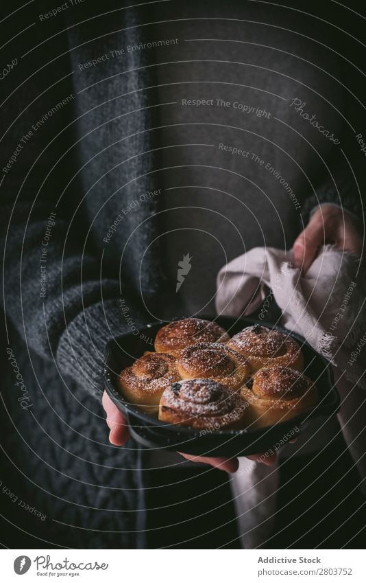 Crop woman holding cinnamon rolls Woman Sauce Hold Napkin Roll Pan Food Meal Fresh Rustic Gourmet Tradition Dish Cooking Baked goods Delicious Tasty yummy