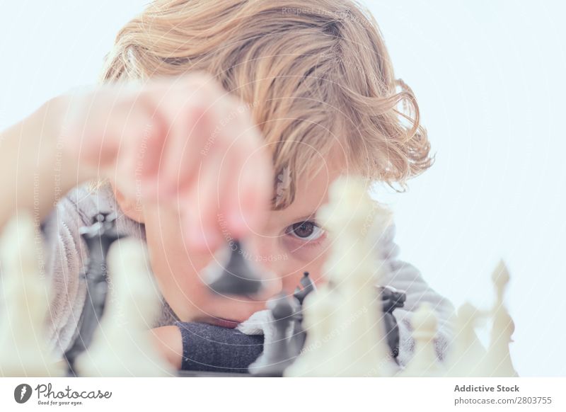 Girl and boy playing chess at home. - a Royalty Free Stock Photo from  Photocase