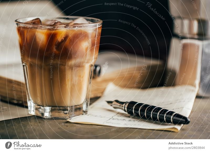 Glass Of Iced Latte With A Straw by Stocksy Contributor Anna