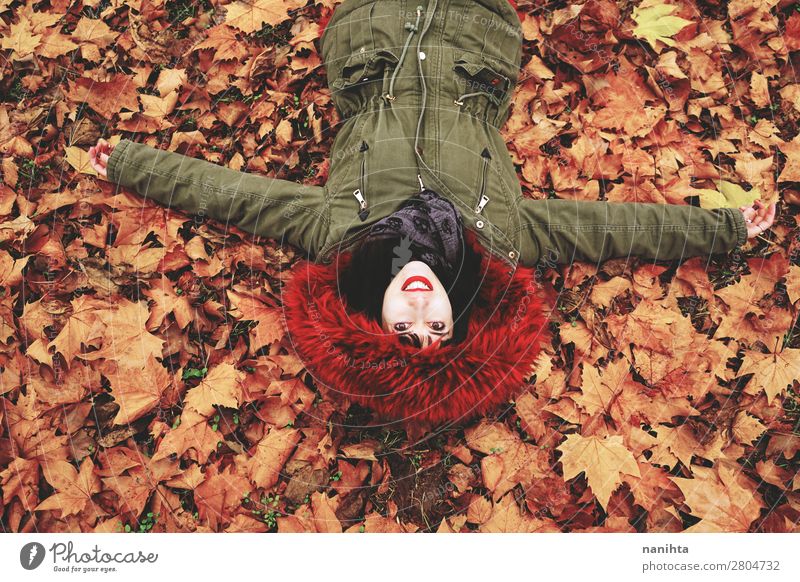 Young woman lying down in the floor full of autumn leaves Face Calm Leisure and hobbies Human being Feminine Woman Adults Youth (Young adults) 1 18 - 30 years