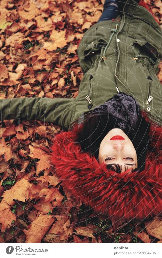 Young woman lying down in the floor full of autumn leaves Lifestyle Style Face Calm Leisure and hobbies Human being Feminine Woman Adults Youth (Young adults) 1