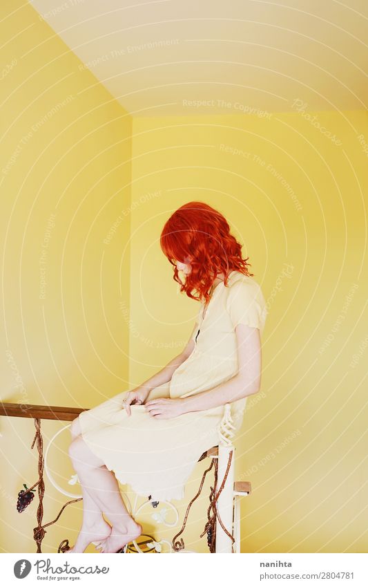 Young redhead woman with a yellow dress in a yellow room Lifestyle Style Beautiful Hair and hairstyles Calm Human being Feminine Young woman