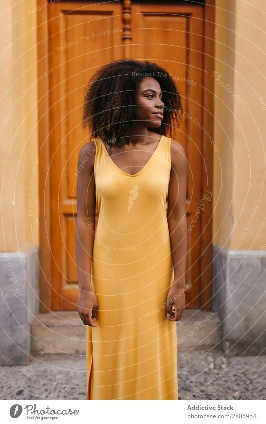 Gorgeous black woman in dress on street Woman Door Black Dress Curly Town To enjoy Barefoot Ethnic African-American Afro Beautiful tender Body Self-confident