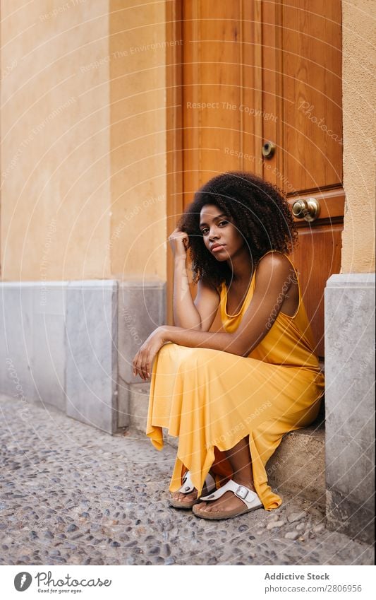 Gorgeous black woman in dress on street Woman Door Black Dress Curly Town To enjoy Barefoot Ethnic African-American Afro Beautiful tender Body Self-confident