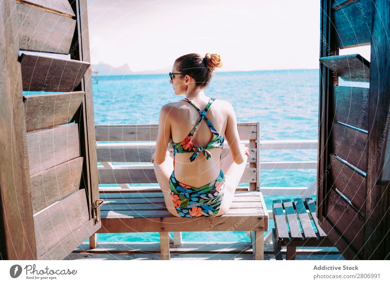 Woman in bikini sitting on bench near water Bikini Ocean Bench Water Jamaica Sunglasses Swimsuit Seat Blue Tropical Exotic Sit Accessory Summer Thin Lady