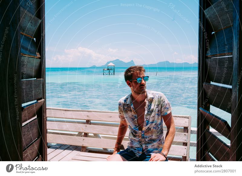 Man in sunglasses sitting on bench near water Sunglasses Ocean Bench Water Jamaica Seat Blue Tropical Exotic Sit Youth (Young adults) Resting Accessory Summer