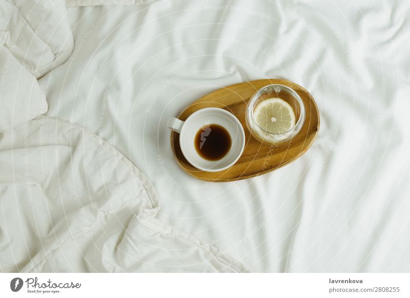 Cup of coffee and lemon water on wooden tray in bed Wood Tray Bedroom Espresso Healthy Healthy Eating holiday Tea Beverage Black Hot Morning Home