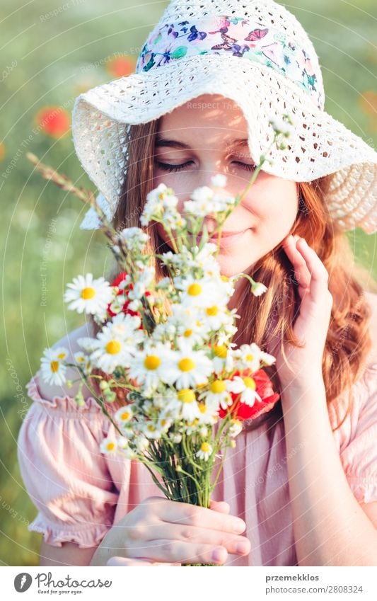 Beautieful young girl in the field of wild flowers Lifestyle Joy Happy Beautiful Summer Garden Child Human being Woman Adults Parents Mother Family & Relations