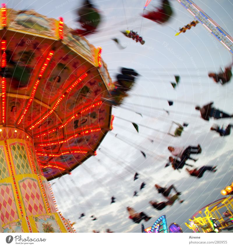 Now it's going round and round! Chairoplane Oktoberfest Fairs & Carnivals Carousel Group Driving To swing Flying Rotate Happiness Funny Round Speed Wild Red