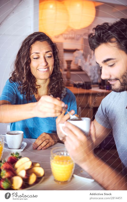 Happy couple having breakfast together Home Youth (Young adults) Grapefruit 2 Breakfast Man Easygoing Human being Life Woman Adults Girl Husband dining Bread