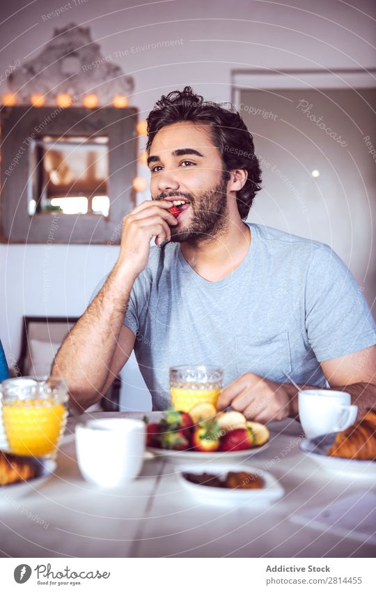 Happy couple having breakfast together Home Youth (Young adults) Grapefruit 2 Breakfast Man Easygoing Human being Life Woman Adults Girl Husband dining Bread