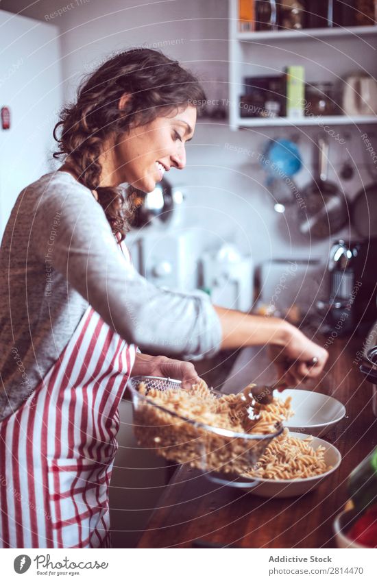 Young couple cooking. Man and woman in their kitchen Cooking Kitchen Home Dinner Youth (Young adults) Eating Wife Adults Smiling Interior design Husband Salad