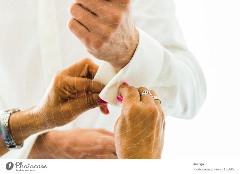 A groom putting on cuff-links in his wedding day. Luxury Elegant Style Wedding Office Business Human being Masculine Man Adults Hand Fingers Fashion Clothing