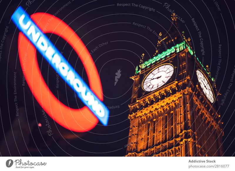 Underground sign and Big Ben tower in London. Horizontal outdoor Tower Monument Architecture Sign Desk Station Transport City Town Deserted Red Exterior shot