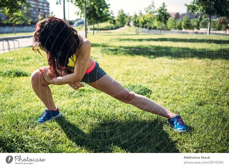 Woman warming up before outdoor workout stretch Runner Light Sports Preparation copy Practice Sit Day Bright Sunbeam Jogger Copy Space Summer Morning Fitness