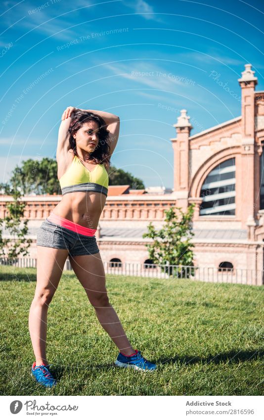 Woman warming up before outdoor workout stretch Runner Light Sports Preparation copy Practice Sit Day Bright Sunbeam Jogger Copy Space Summer Morning Fitness