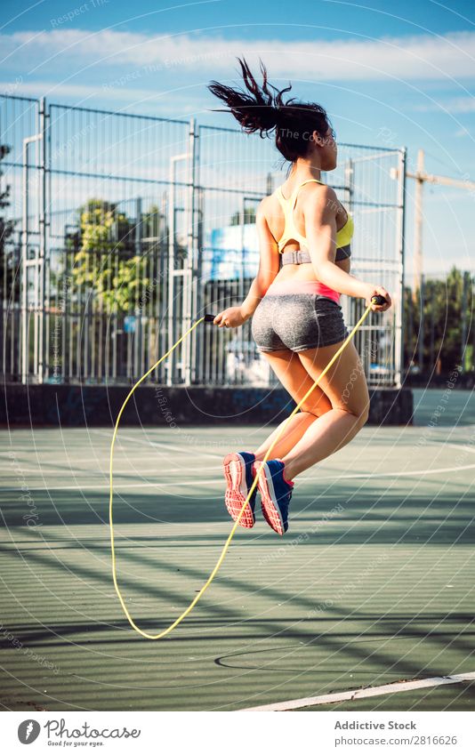 Fitness woman doing skipping workout with jump rope Sunlight Model Thin Preparation Action Park copy Athletic Practice Racing sports Day Adults Sunbeam