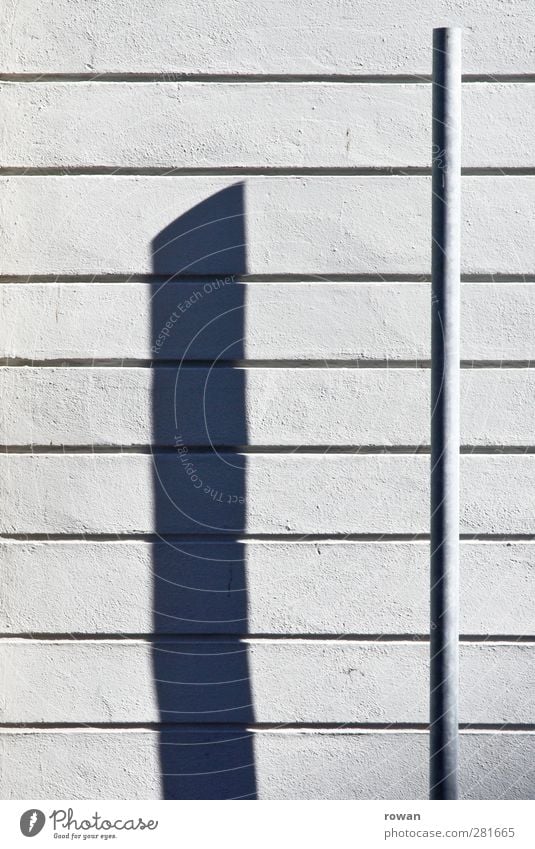 shadow cast Manmade structures Wall (barrier) Wall (building) Facade Esthetic Line Lined At right angles Drop shadow Rendered facade White Graphic Contrast