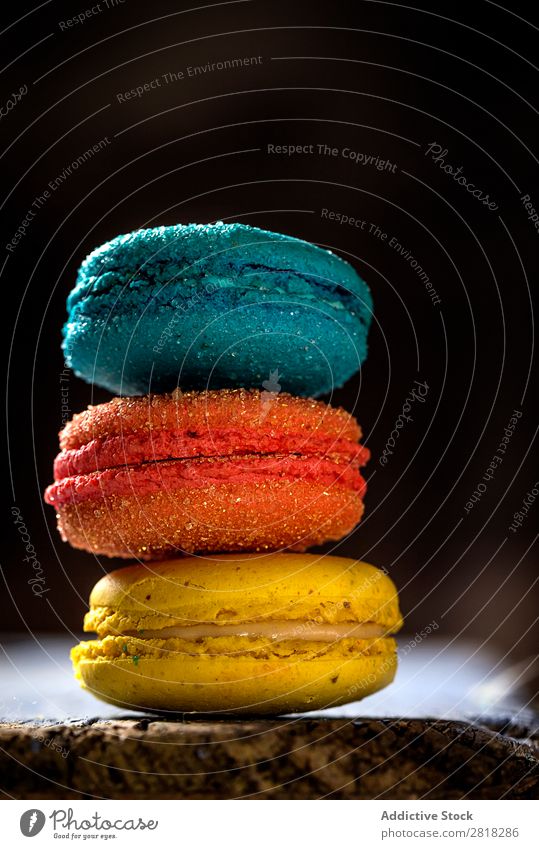 Appetizing colorful macaroons Macaron Dessert Food Candy Sweet Colour Coffee Yellow Blue Green Orange French delicious chocolate Close-up Sugar Vertical