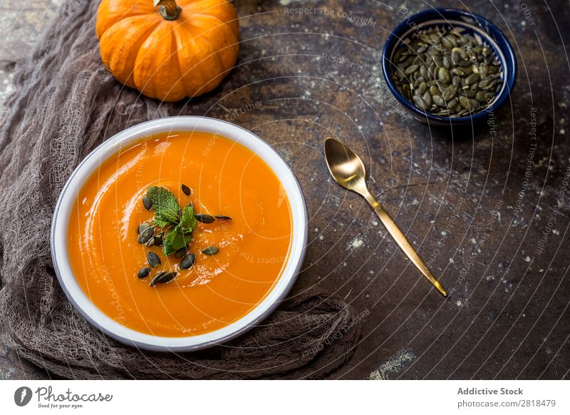 Pumpkin cream on bowl Cream Soup Healthy Eating Stew pumpkin pipes Vegetable Vegetarian diet Tradition Home-made Spoon Napkin Wood Plate Bowl Mint Dinner Diet