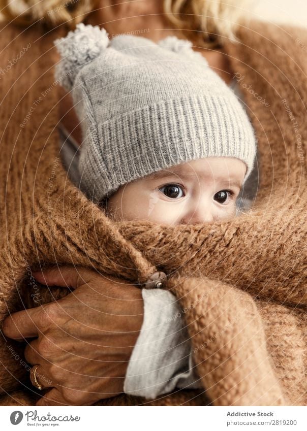 baby peeping out throught jacket Baby Child Boy (child) mum Mother Jacket Grandmother Nice Cool (slang) Cute pretty Beauty Photography Small Eyes Smiling