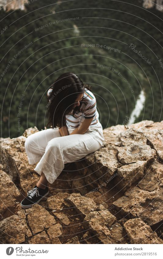 Woman sitting on stone Stone Mountain Nature Youth (Young adults) Girl Rock Vacation & Travel Summer Happy Human being Adventure Beautiful Landscape