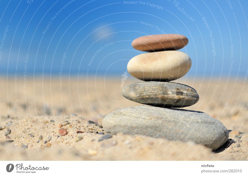 Stones on the beach Relaxation Beach Ocean Sand Beautiful weather Coast Tower Emotions Contentment Power Willpower Loyal Warm-heartedness Beginning Loneliness