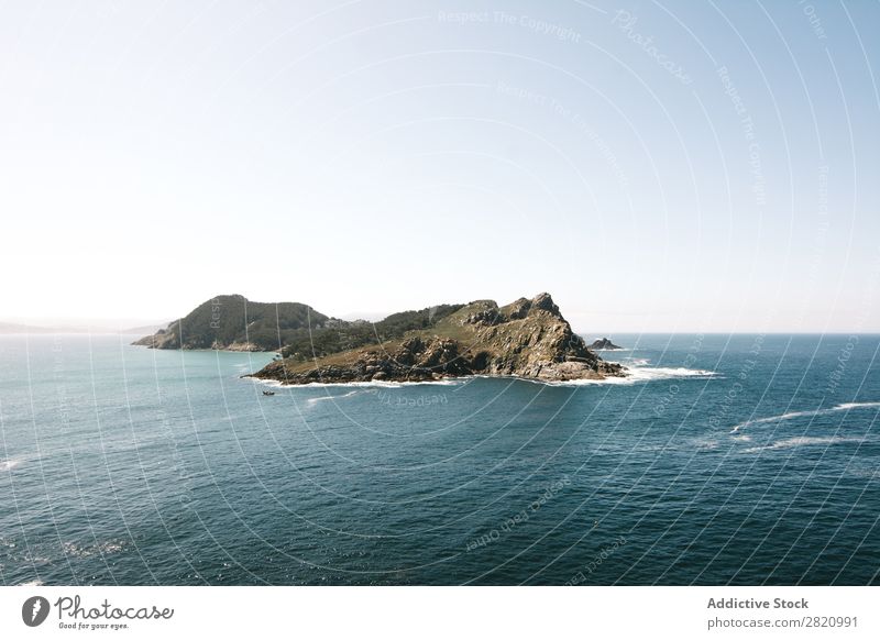 Cliff in middle of ocean Ocean Water Panorama (Format) Landscape Horizon Nature Rock Skyline Peaceful Vantage point Weather Tourism Destination Island Adventure