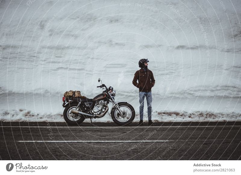 Man with motorcycle in snowy road Snow Motorcycle Traveling Transport Adventure Nature Panorama (Format) Tourism Trip Arranged Landscape Valley Highlands