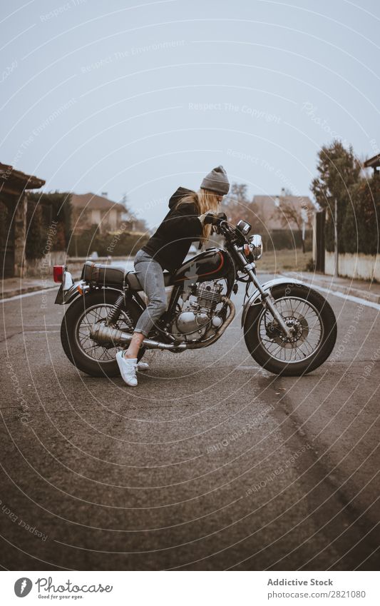 Young girl posing on motorcycle Woman Motorcycle Earnest Leather Self-confident Transport Rider Rebel Uniqueness Lifestyle Vacation & Travel Nature