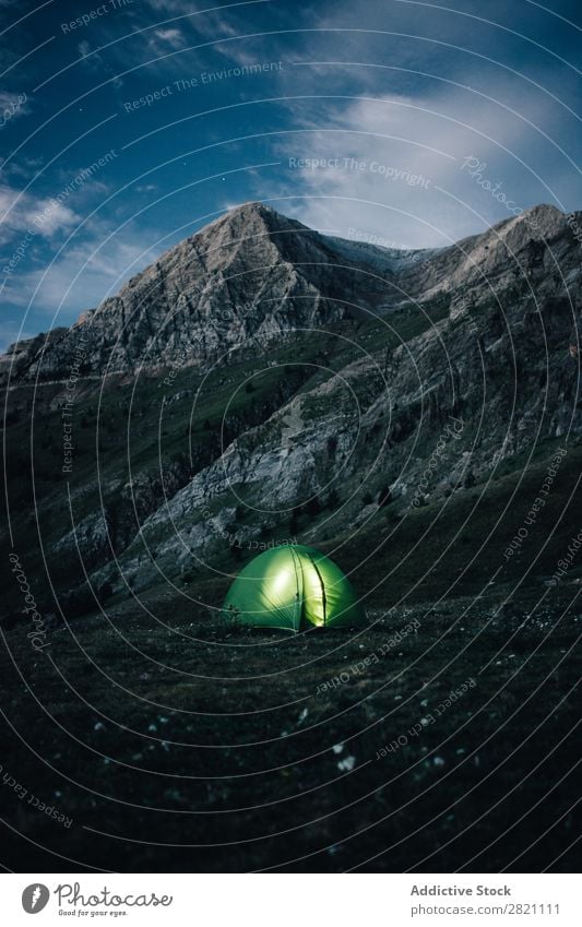 Illuminated tent in mountains Mountain Tent Evening Adventure Tourism Slope Nature Landscape Sky Night Hiking Light Exterior shot Wilderness glowing Glow Remote