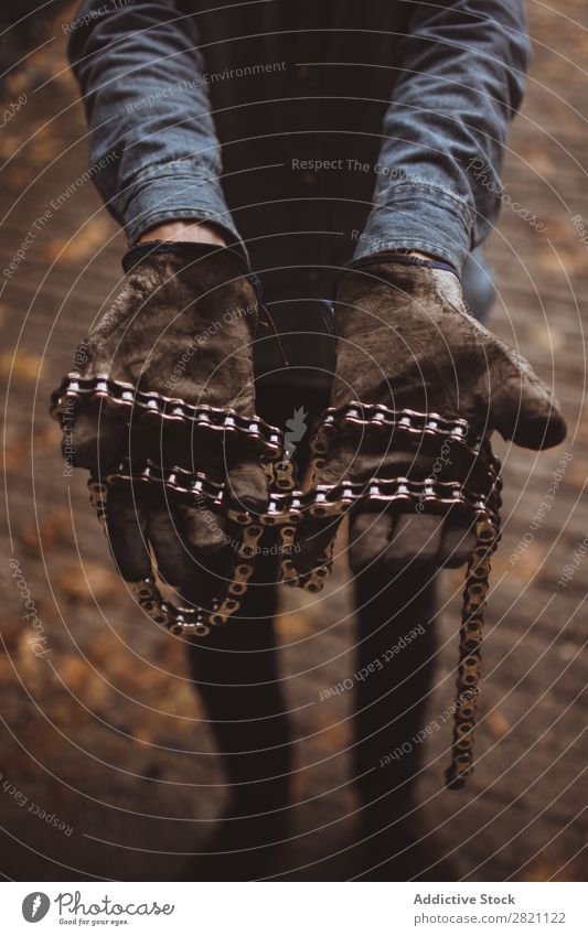 Man holding motorcycle chains Gloves Hand Workwear Iron chain Motorcycle Dirty Equipment Protective Protection Safety Employees &amp; Colleagues Industry