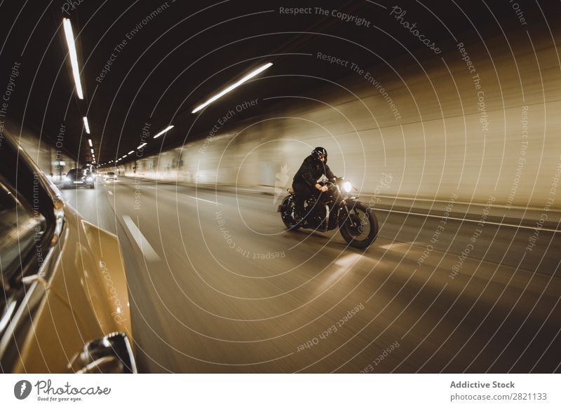 Biker riding in tunnel Man Motorcycling Motorcycle Speed Ride Tunnel Engines Bicycle Rider Vacation & Travel Lifestyle Street Racing sports Freedom Adventure