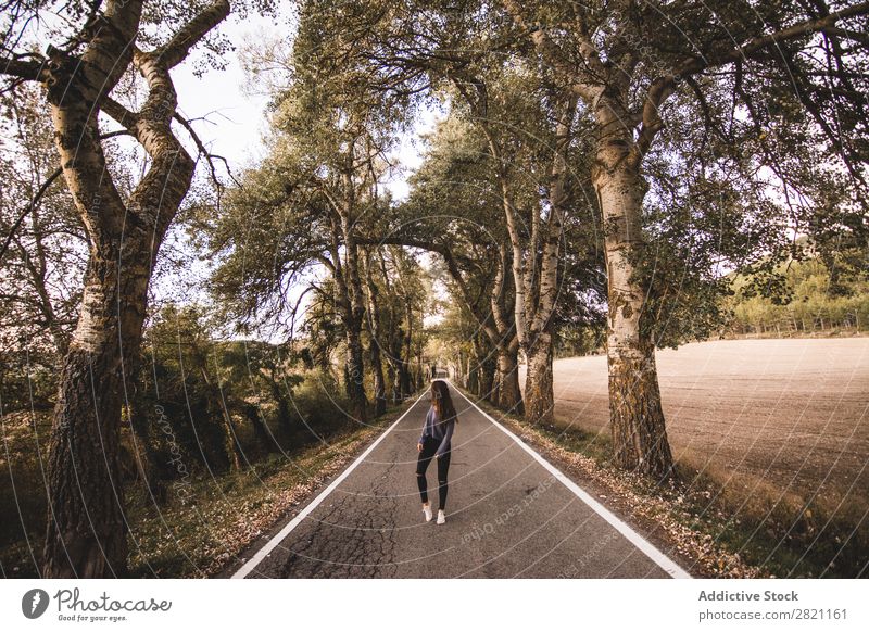Woman walking on rural road Street Field Vacation & Travel Landscape fresh air Gravel Retro Grass Dry Nature way Lanes & trails Highway Beautiful Picturesque