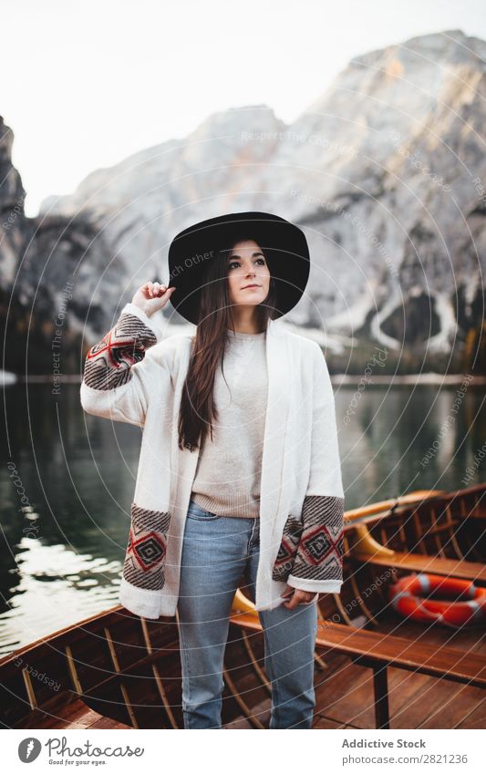 Woman in boat Lake Mountain Watercraft Vantage point Landscape Nature Sky Beautiful Tourism Vacation & Travel Peak scenery Day Environment Human being
