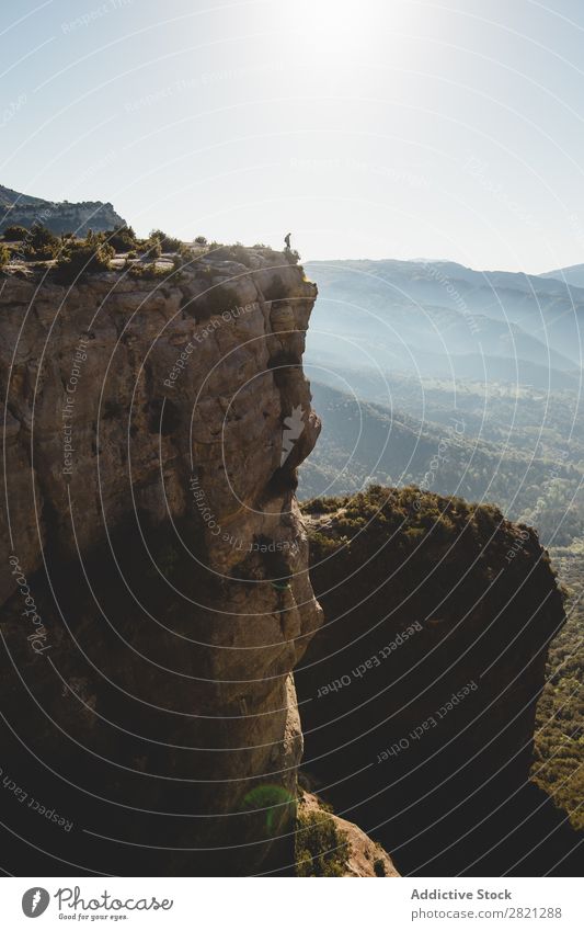 Man standing on top of cliff Cliff Landscape Stand Edge Adventure Exterior shot Rock Hiking Extreme Mountain Nature Peak Tourist Height Action Vacation & Travel