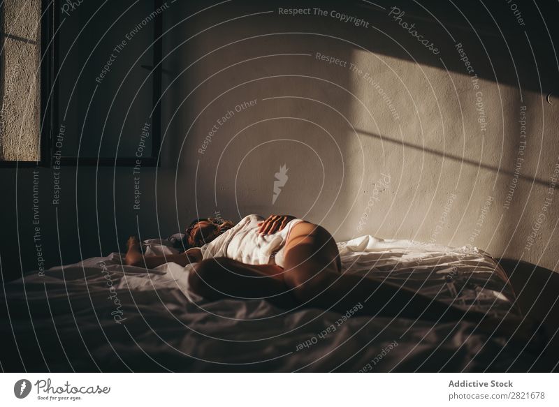 Sensual woman lying on bed in sunlight Woman Bed Lie (Untruth) Sleep Sunlight Copy Space Background picture Intimate Intimacy Wall (building) Skin tan