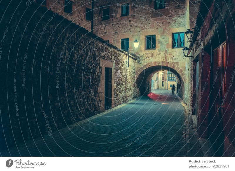 Person walking on street at night Street Night Dark Town Light City Human being Walking Building Architecture Alley Asphalt Vacation & Travel Evening way