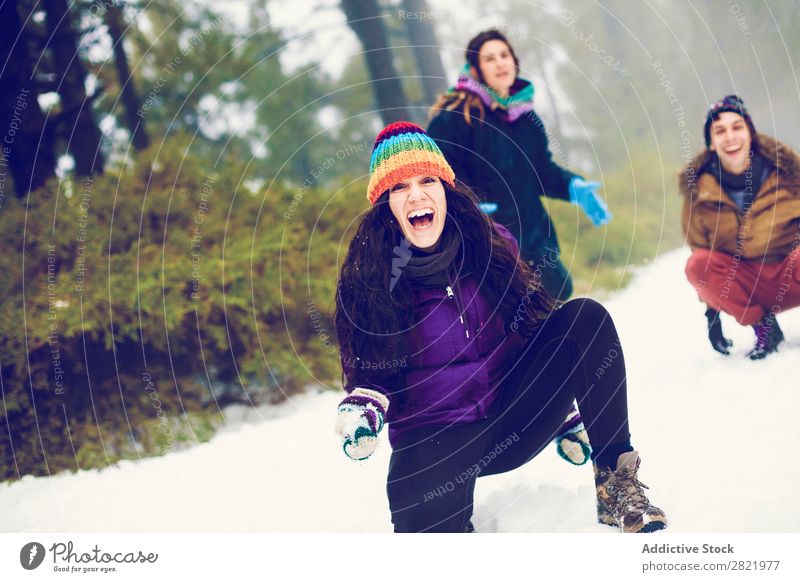 Friends playing snowballs in woods Human being Friendship Snow ball Playing Forest throwing having fun Entertainment Leisure and hobbies Action Movement Winter