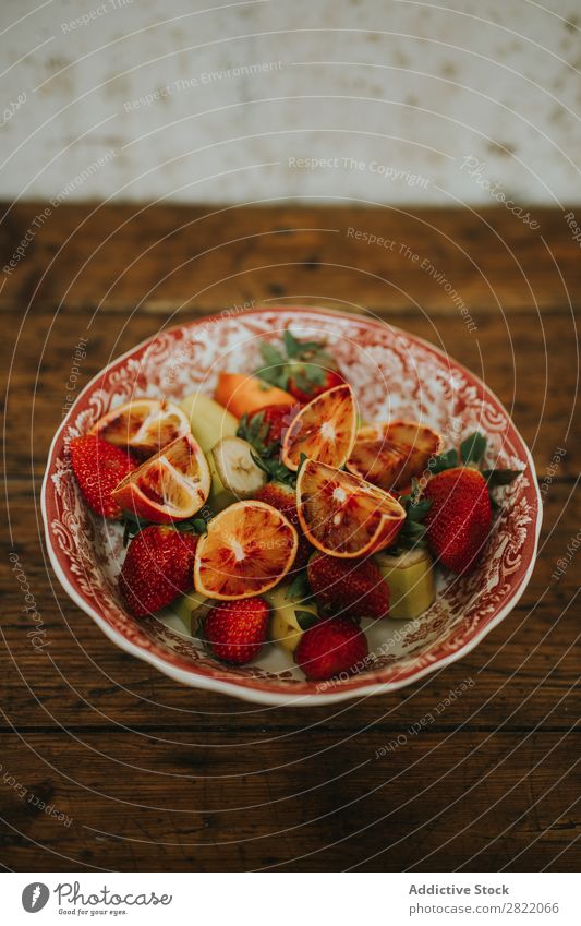 Bowl with different fruits Plate Fruit assortment Orange Red Strawberry Banana pieces Healthy Food Fresh Diet Breakfast Dessert Multicoloured assorted Nutrition