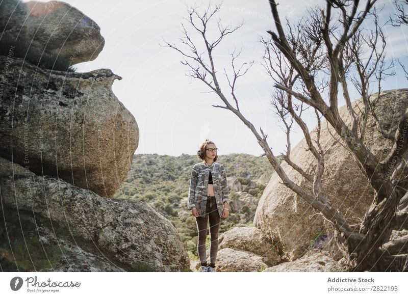 Pretty young woman standing on cliff Woman Style Nature Cliff Rock Stone Stand Sunbeam Day Attractive Beautiful Youth (Young adults) Fashion Hipster pretty