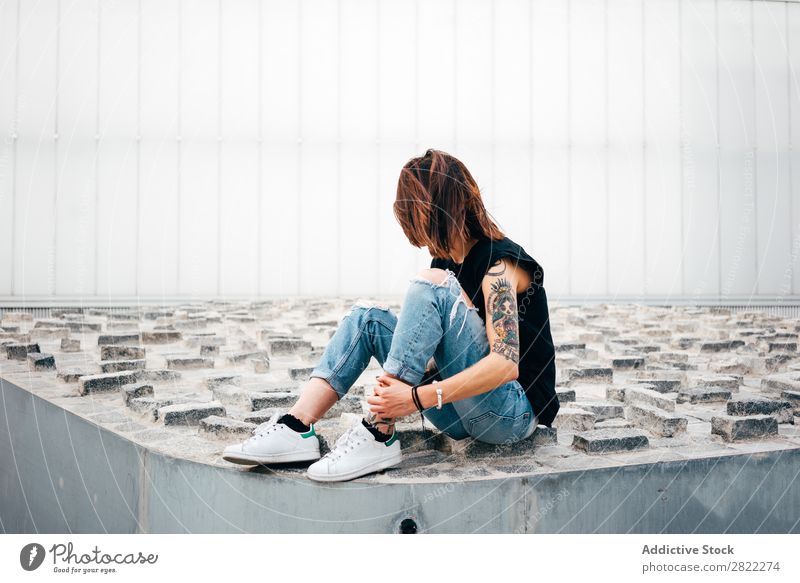 Unrecognizable tattooed woman on pavement Woman Style Tattoo Sit Old Relief Pavement Street Beautiful Youth (Young adults) Fashion Hipster pretty Cool (slang)