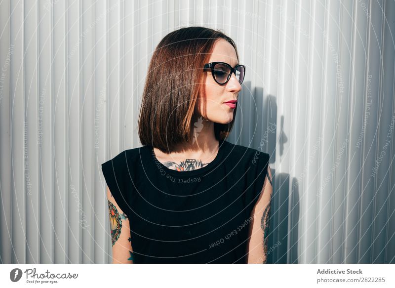 Stylish young woman standing at metal wall Woman Style Tattoo Street Beautiful Youth (Young adults) Sunglasses Fashion Hipster pretty Cool (slang)