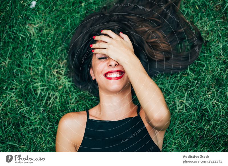 Cheerful brunette woman lying in grass Woman pretty Youth (Young adults) Beautiful Smiling Lie (Untruth) Grass Nature Brunette Attractive Human being